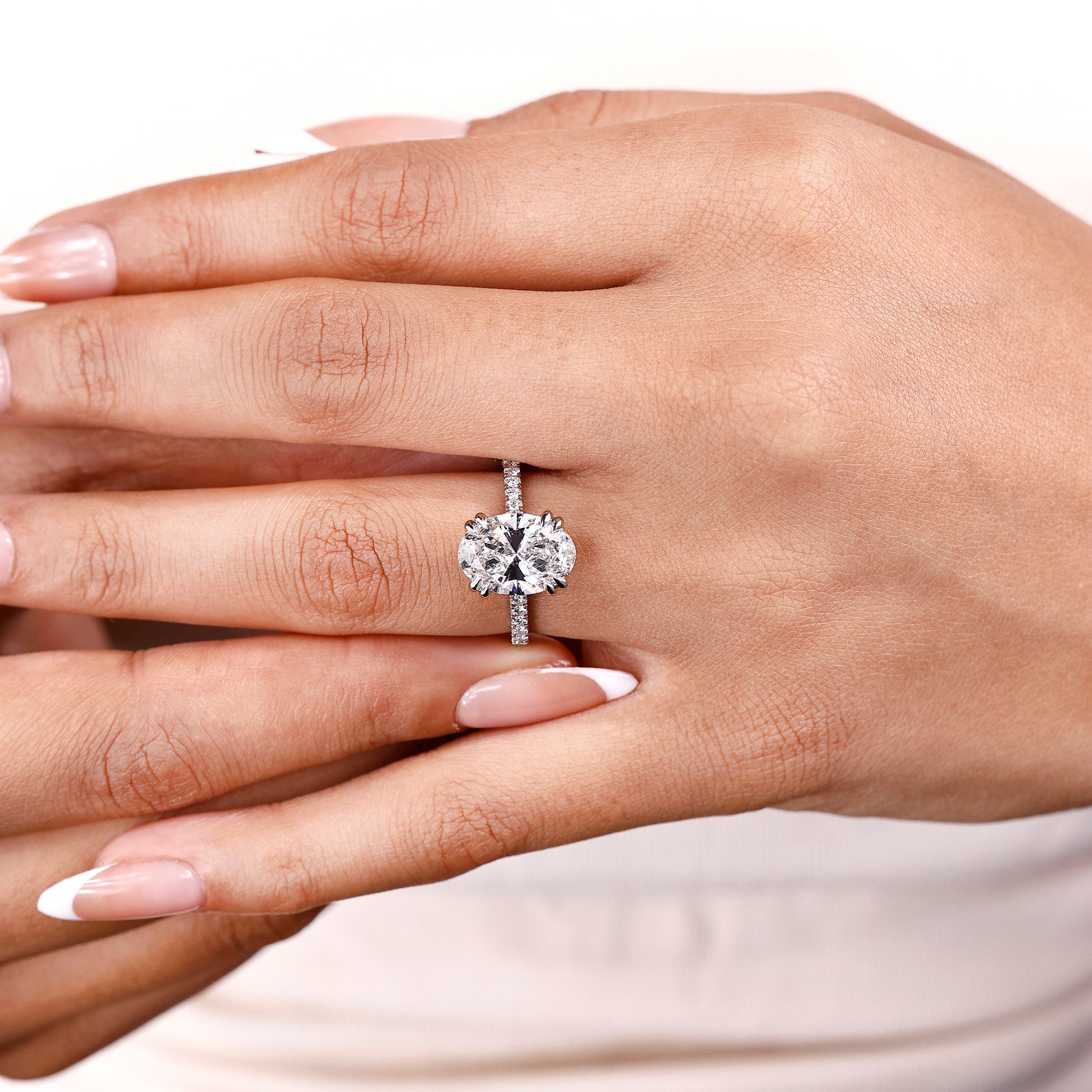 IGI certified hidden halo ring with oval cut diamond
