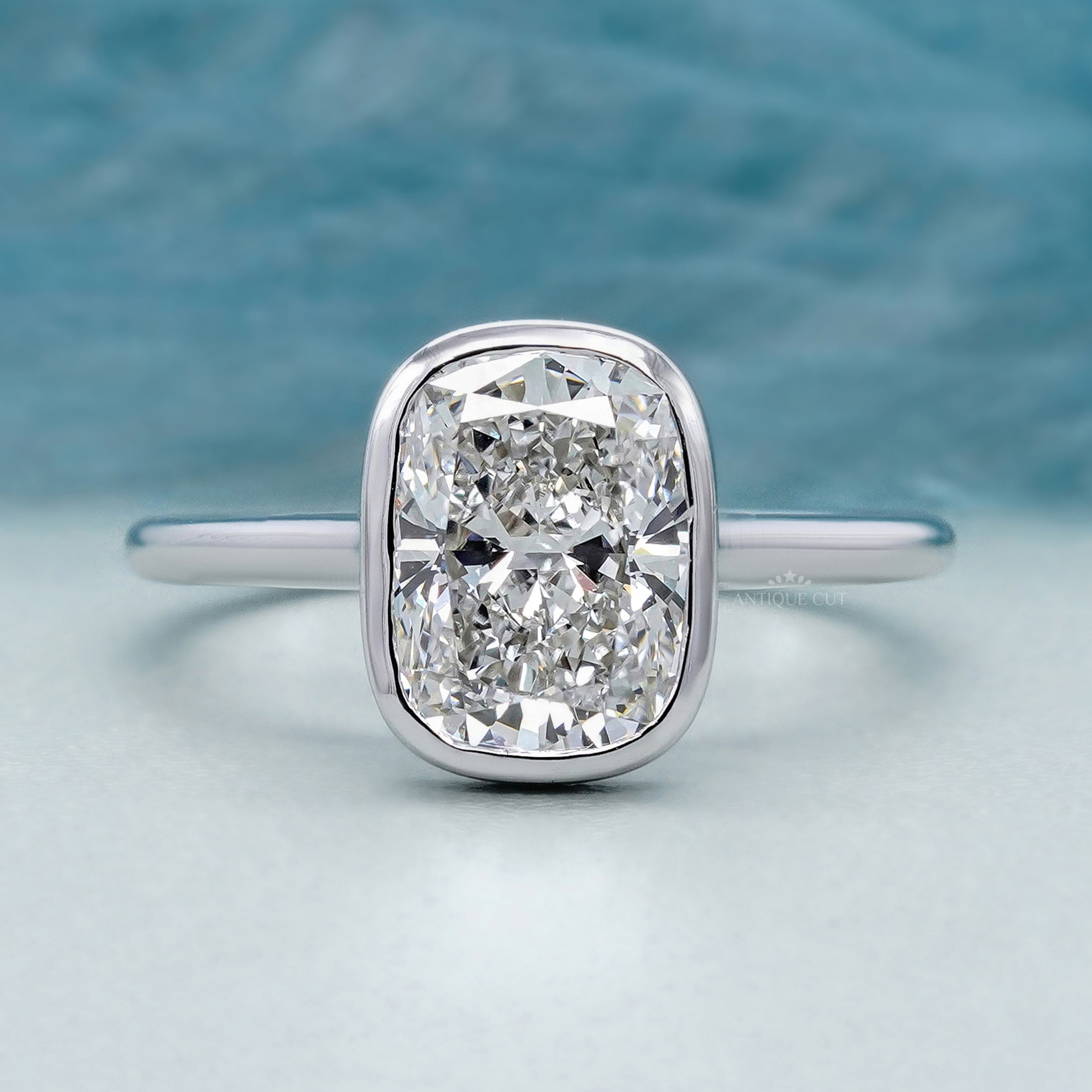 Cushion solitaire engagement ring in white gold