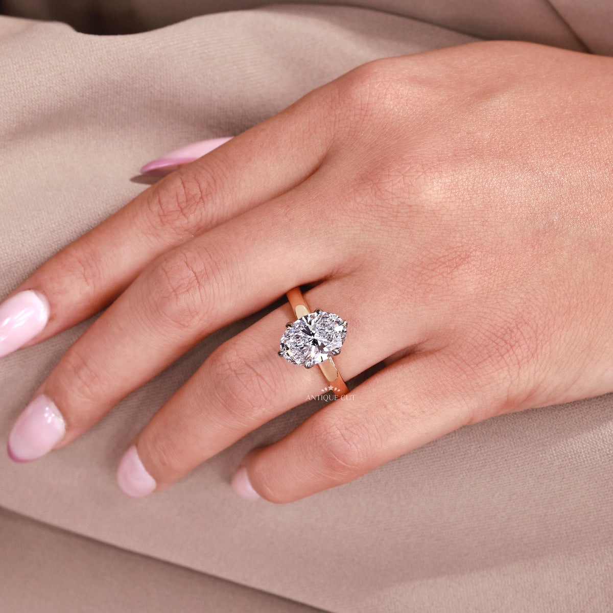 Oval cut lab diamond engagement ring with gold band
