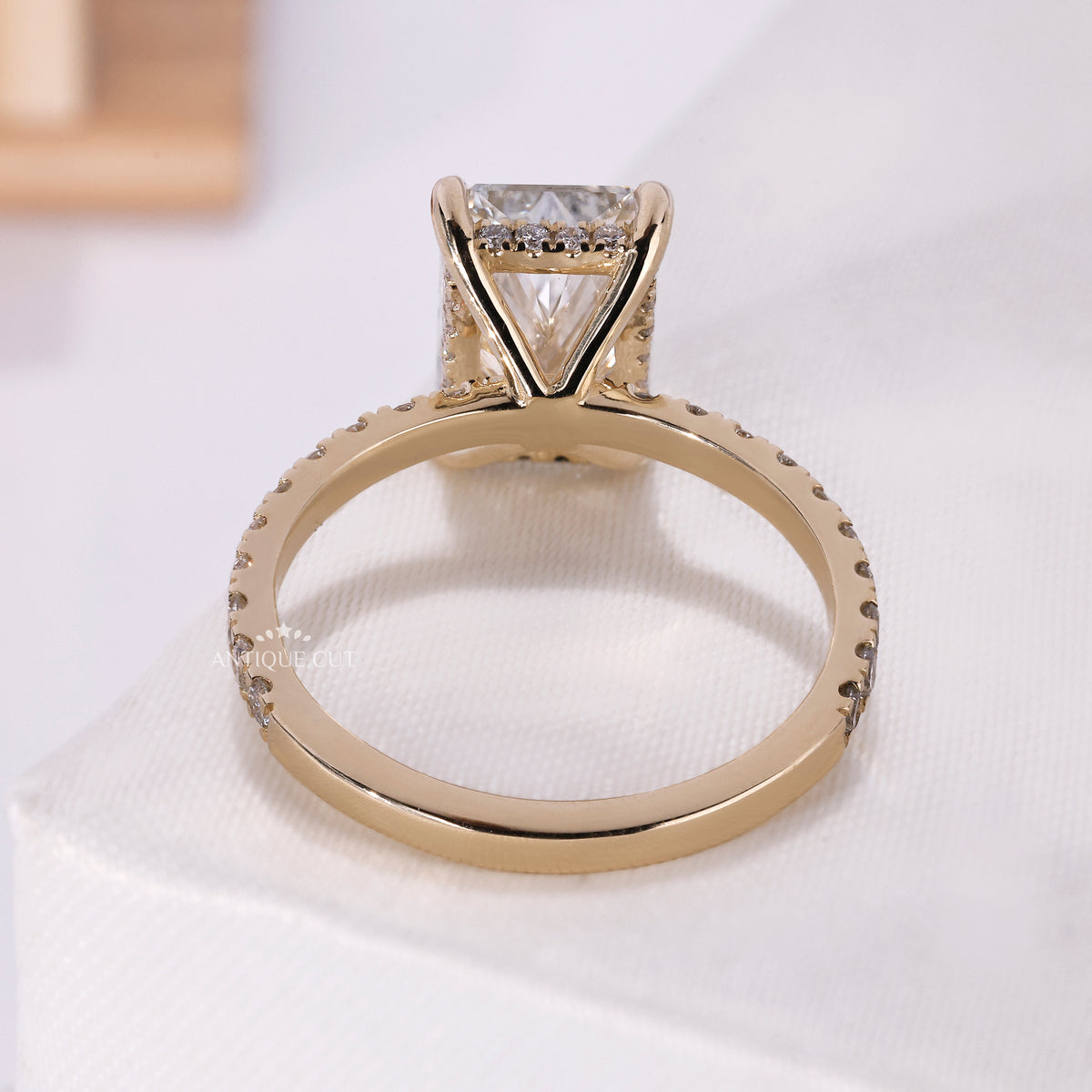Hidden halo radiant diamond ring with pave band