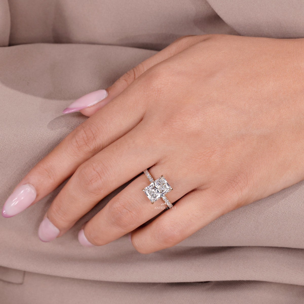Lab grown diamond ring with radiant cut center stone