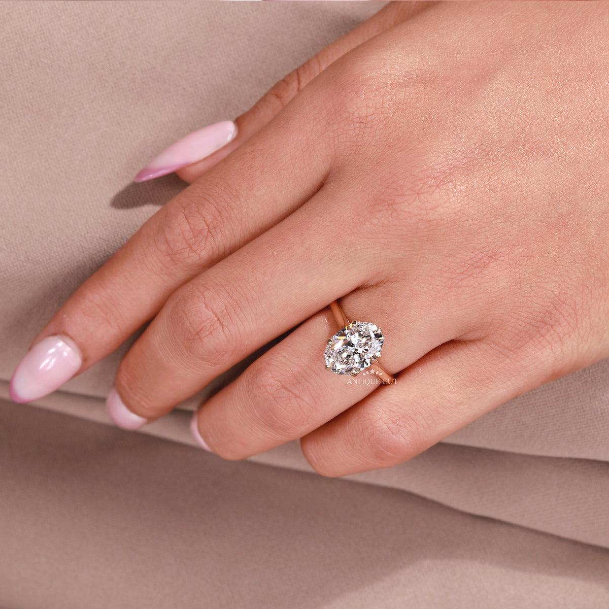 Yellow gold oval diamond engagement ring with tulip setting