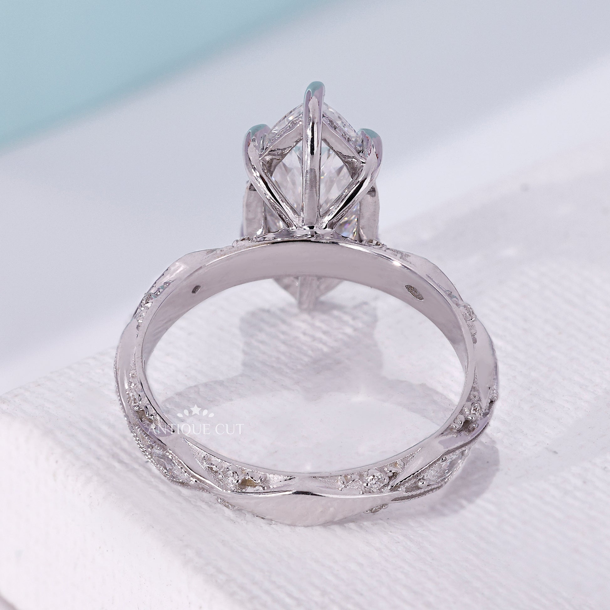 Antiquecut engagement ring with a six-claw setting
