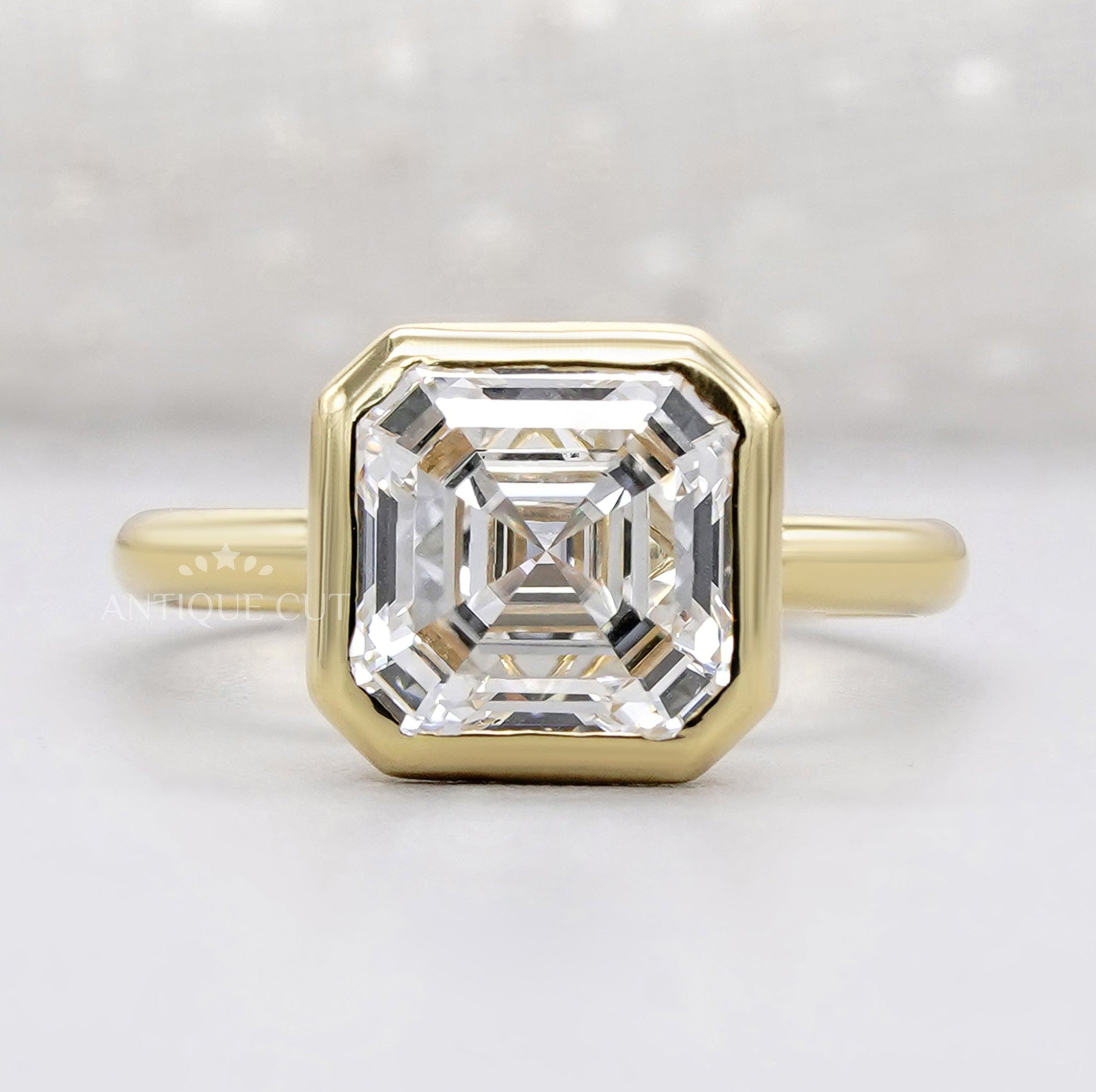 Ascher cut bezel engagement ring in yellow gold