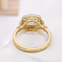 Close-up of scalloped yellow gold setting around the cushion diamond