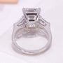 White gold emerald cut and baguette engagement ring