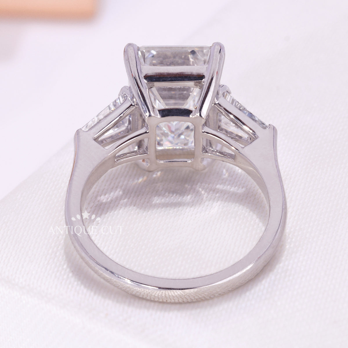 White gold emerald cut and baguette engagement ring
