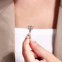 Close-up of emerald cut side stones beside the radiant center