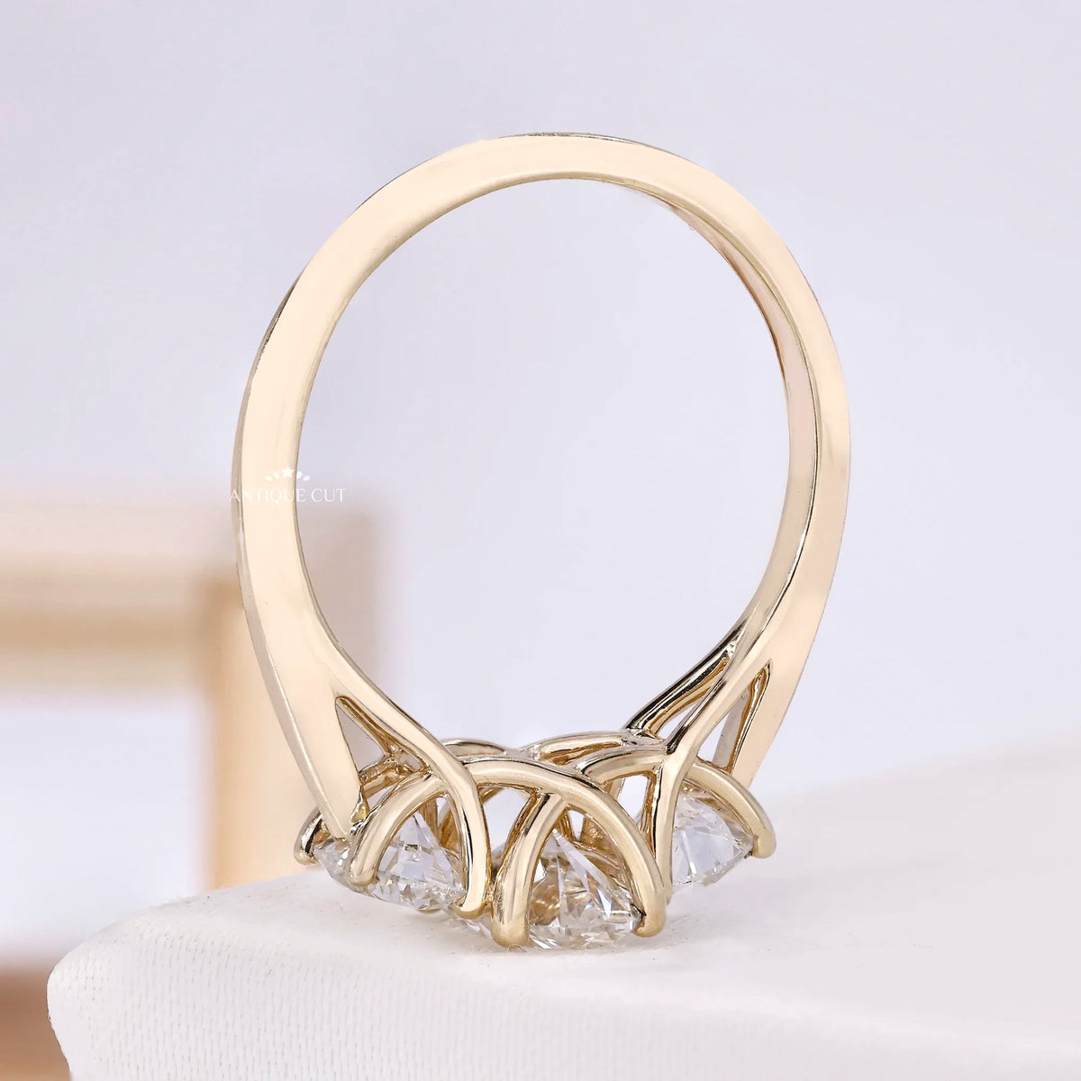1.50 Carat Lab Grown Oval Cut Center Diamond & Two Round Side Stones With Trellis Gallery Setting