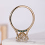 Oval center diamond ring with yellow gold accent band