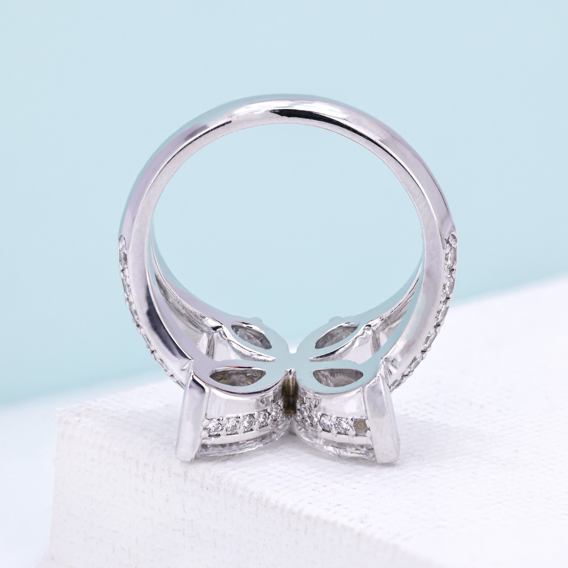 Butterfly diamond ring with V and claw prongs