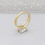 Yellow gold engagement ring with radiant cut center stone