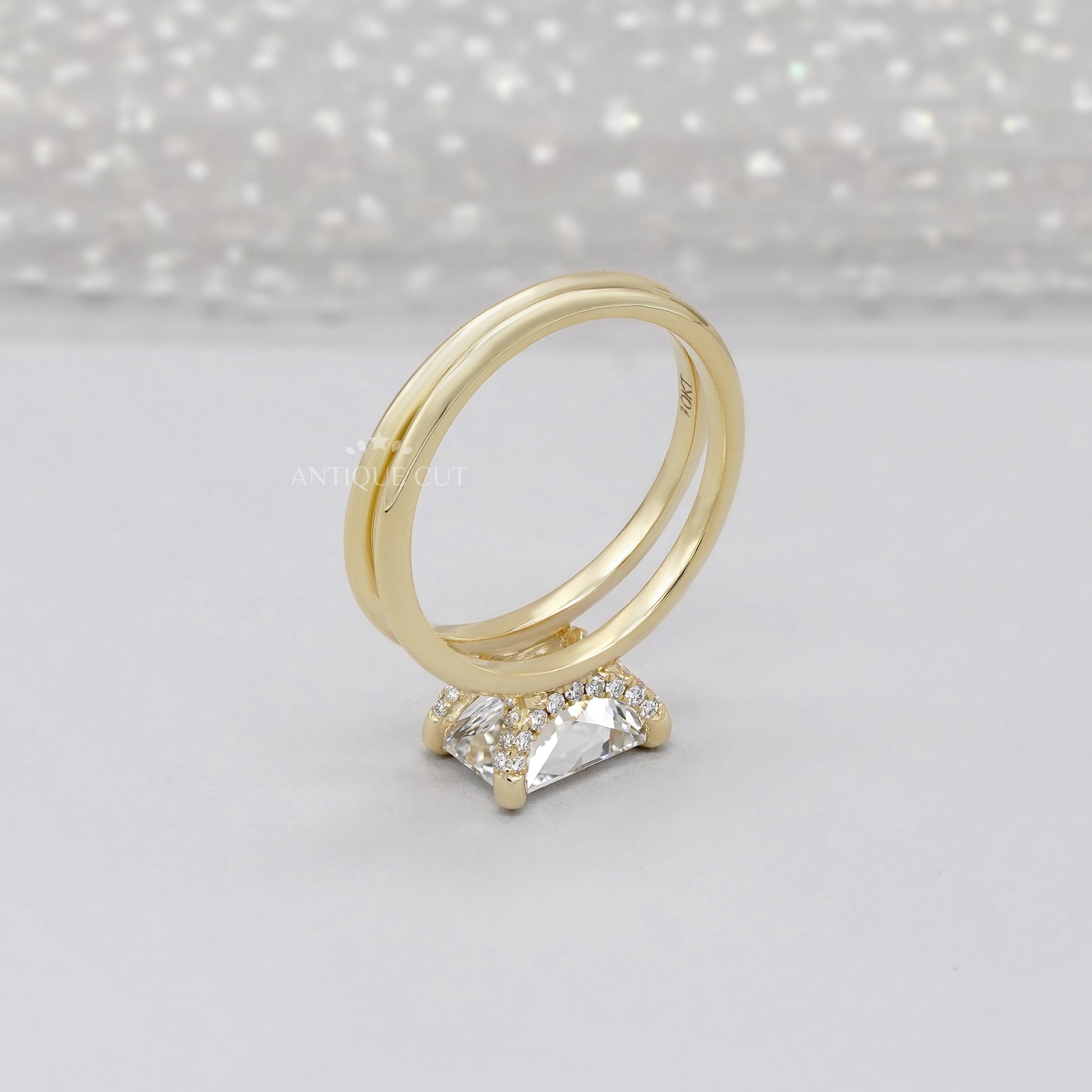 Yellow gold engagement ring with radiant cut center stone