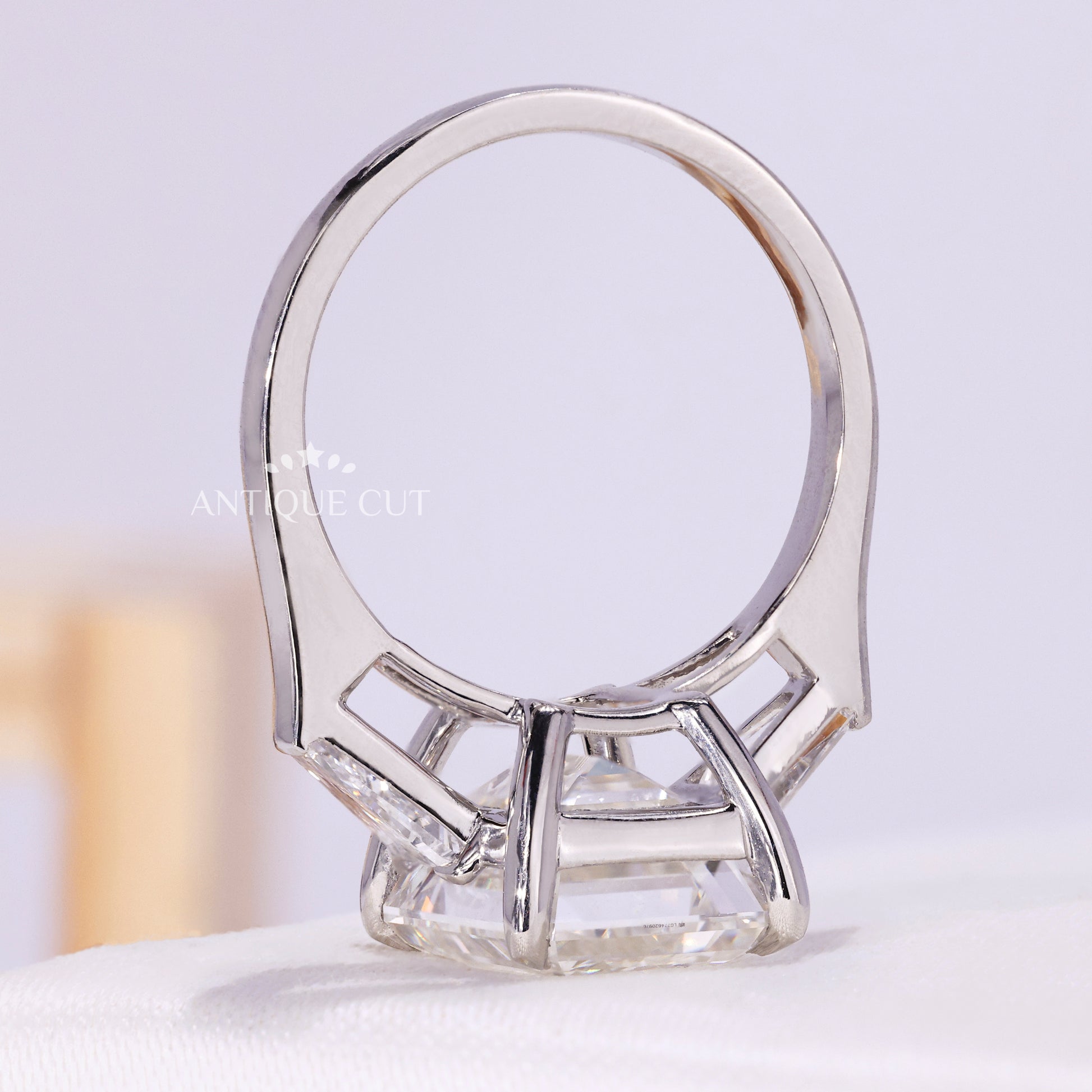 Three stone emerald engagement ring front view