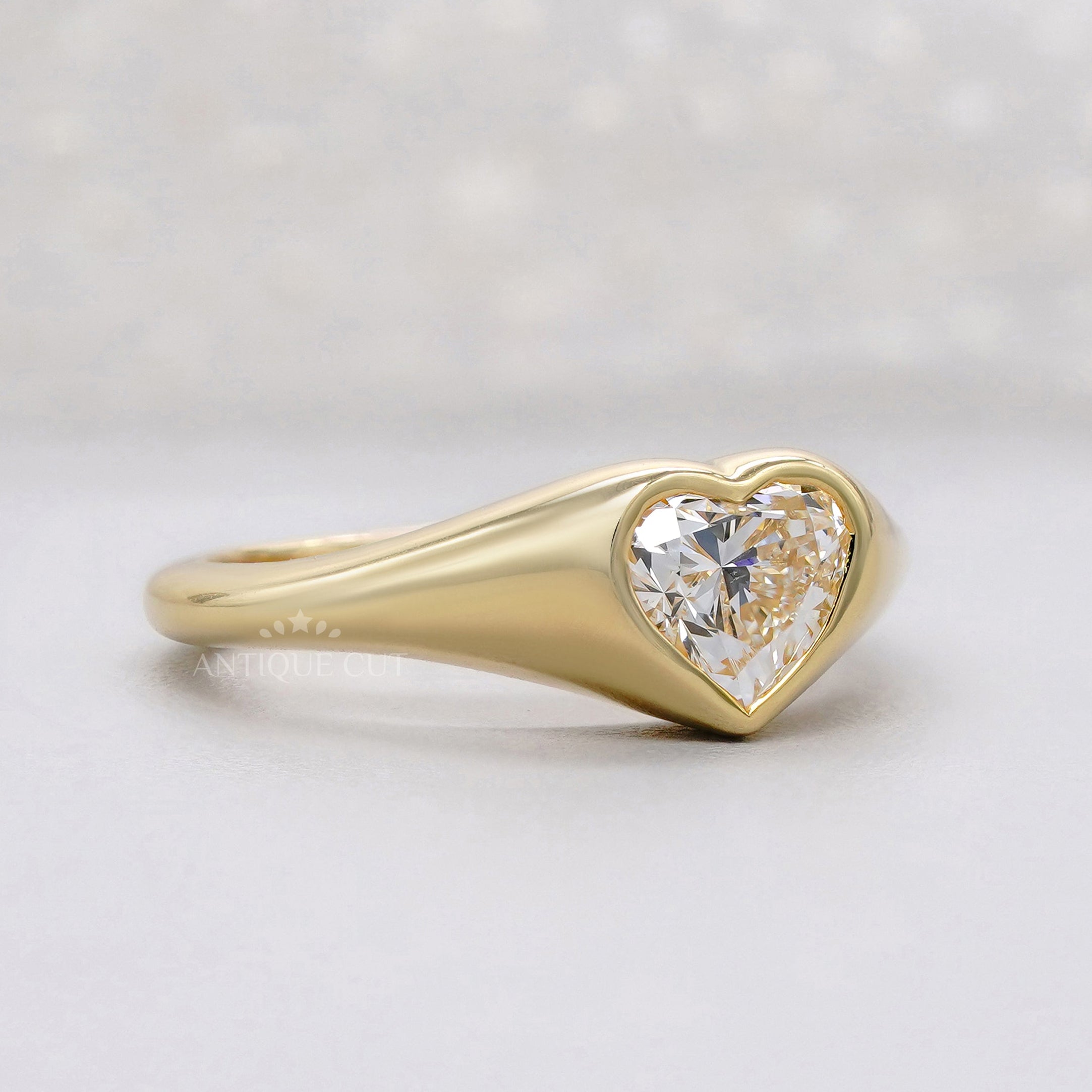 Heart shaped lab grown diamond ring with bezel setting