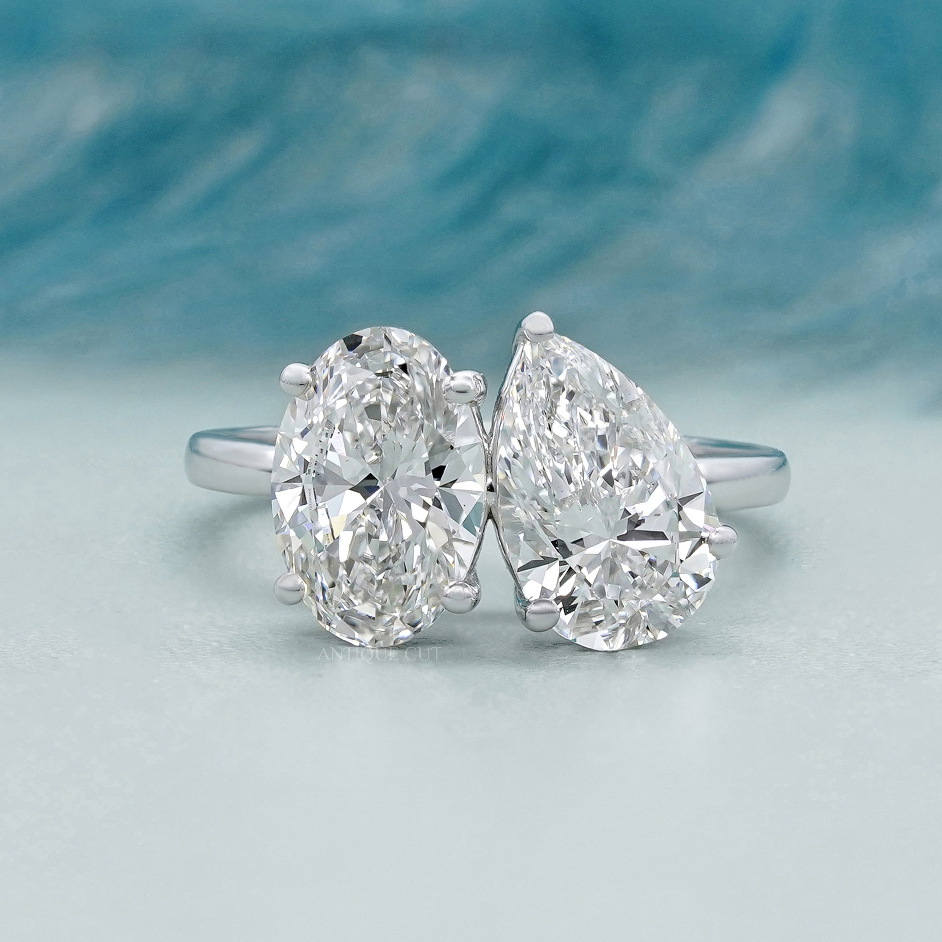 Oval and pear shaped Toi Et Moi engagement ring in white gold