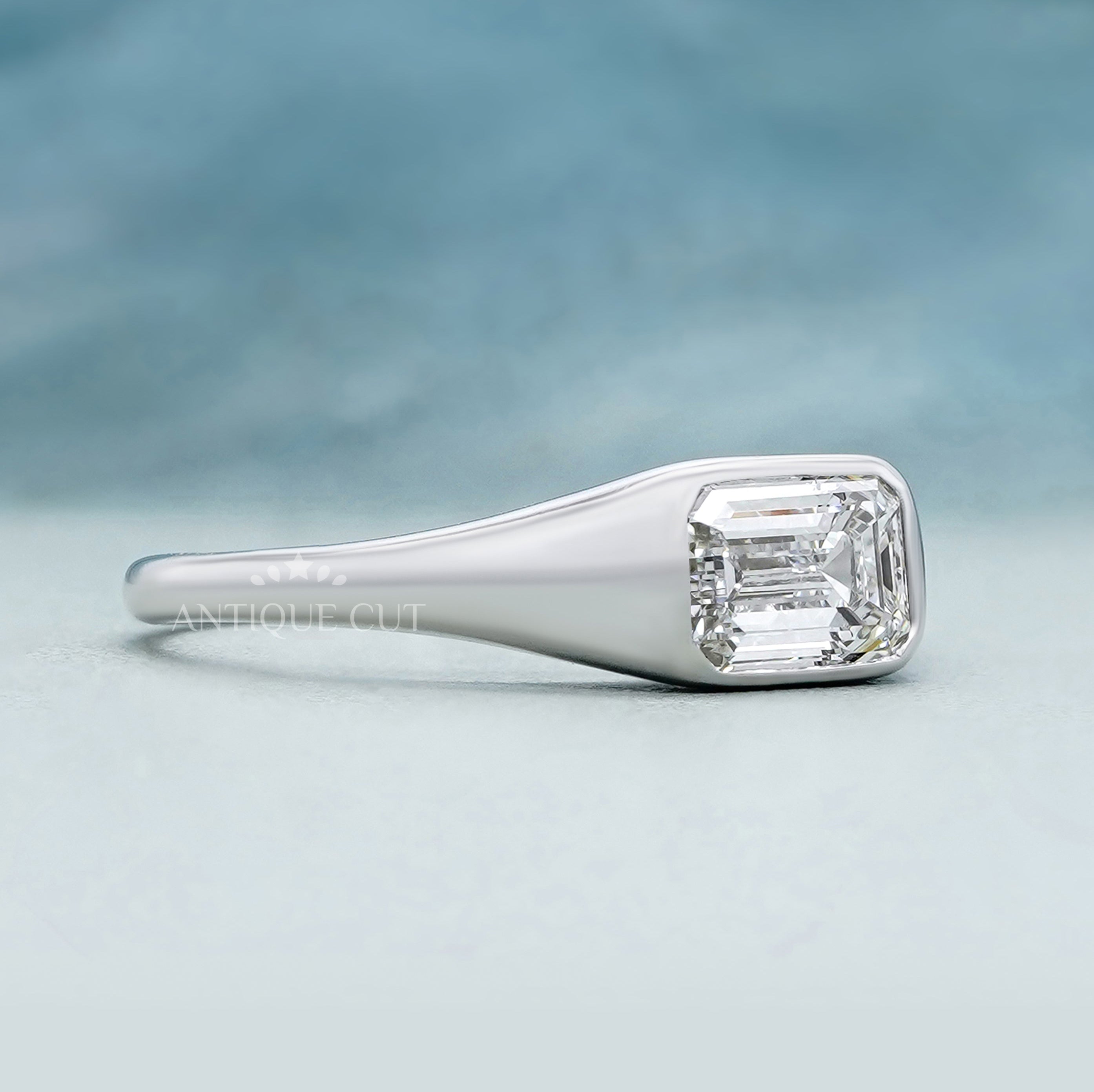 Lab grown emerald cut engagement ring horizontal setting