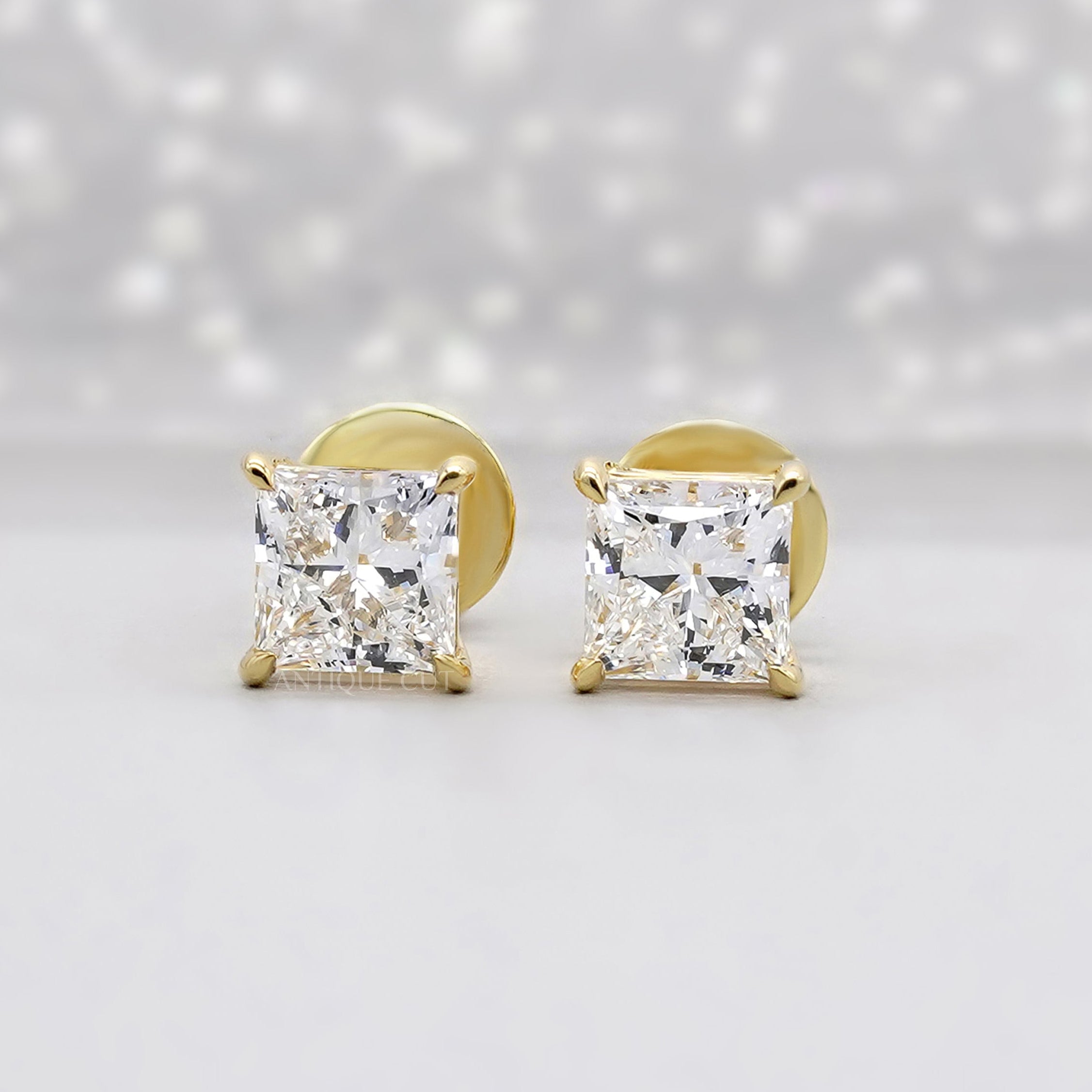 Princess cut lab grown diamond stud earrings in yellow gold