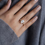 Classic three stone engagement ring in yellow gold