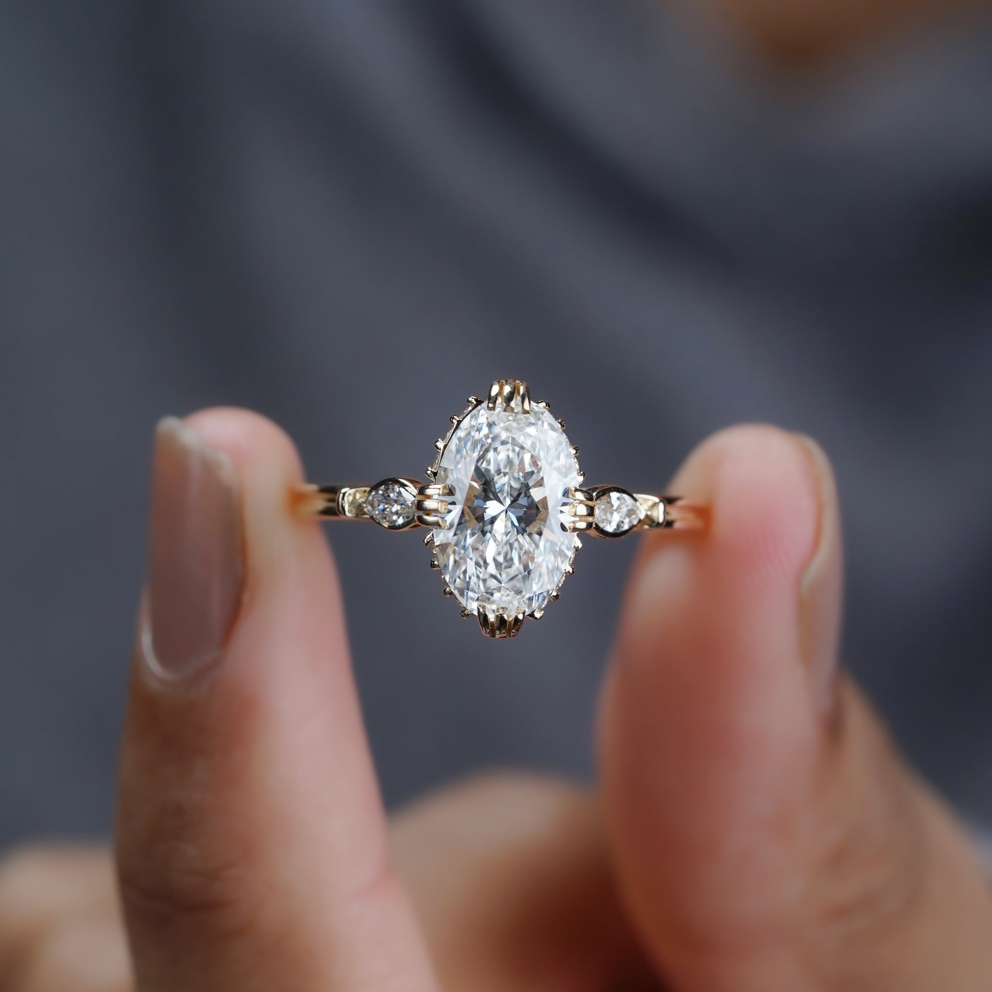 Oval diamond ring side profile with halo and side stones
