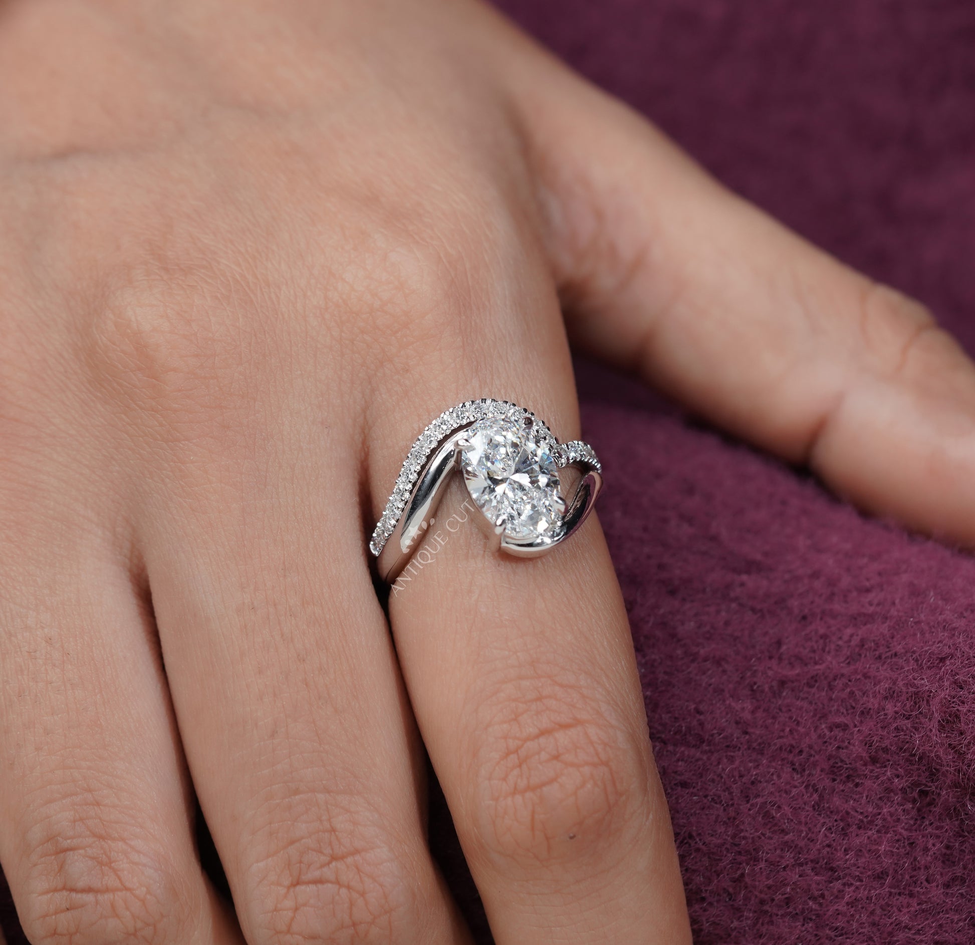 Oval diamond ring with claw prong setting and IGI certification