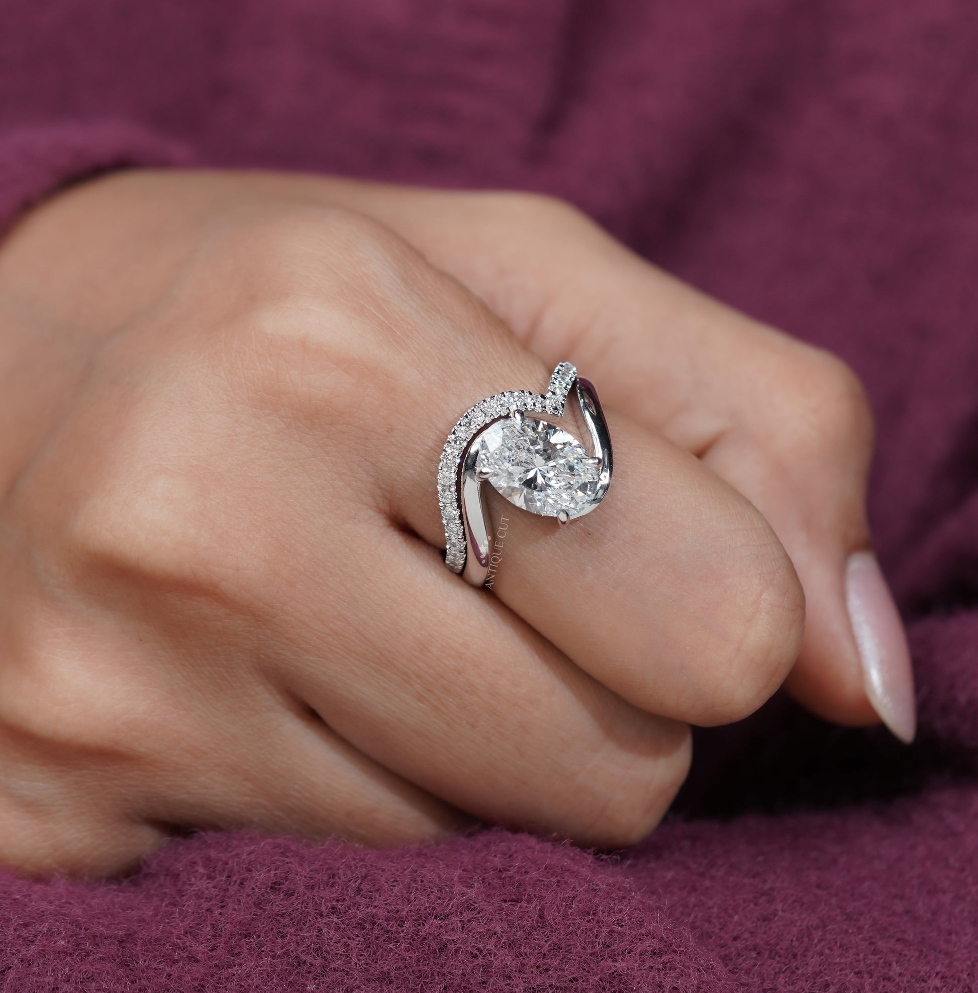 Antiquecut oval bypass engagement ring