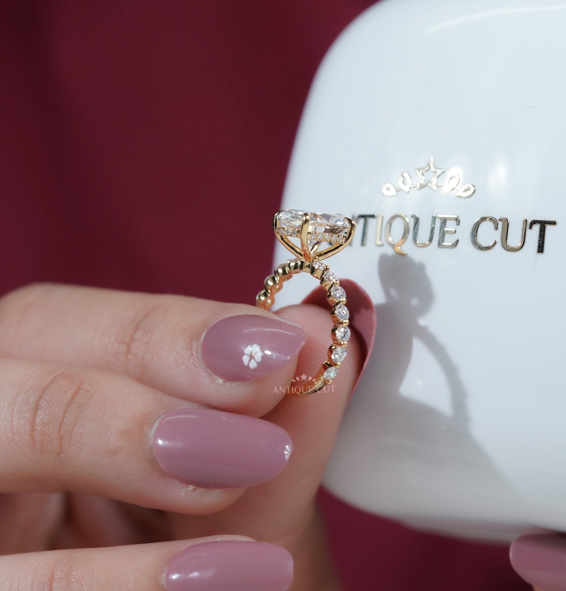 Hidden Halo Oval Engagement Ring with Shared-Prong Accent Band
