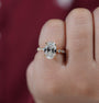 Oval lab grown diamond ring with round side stones