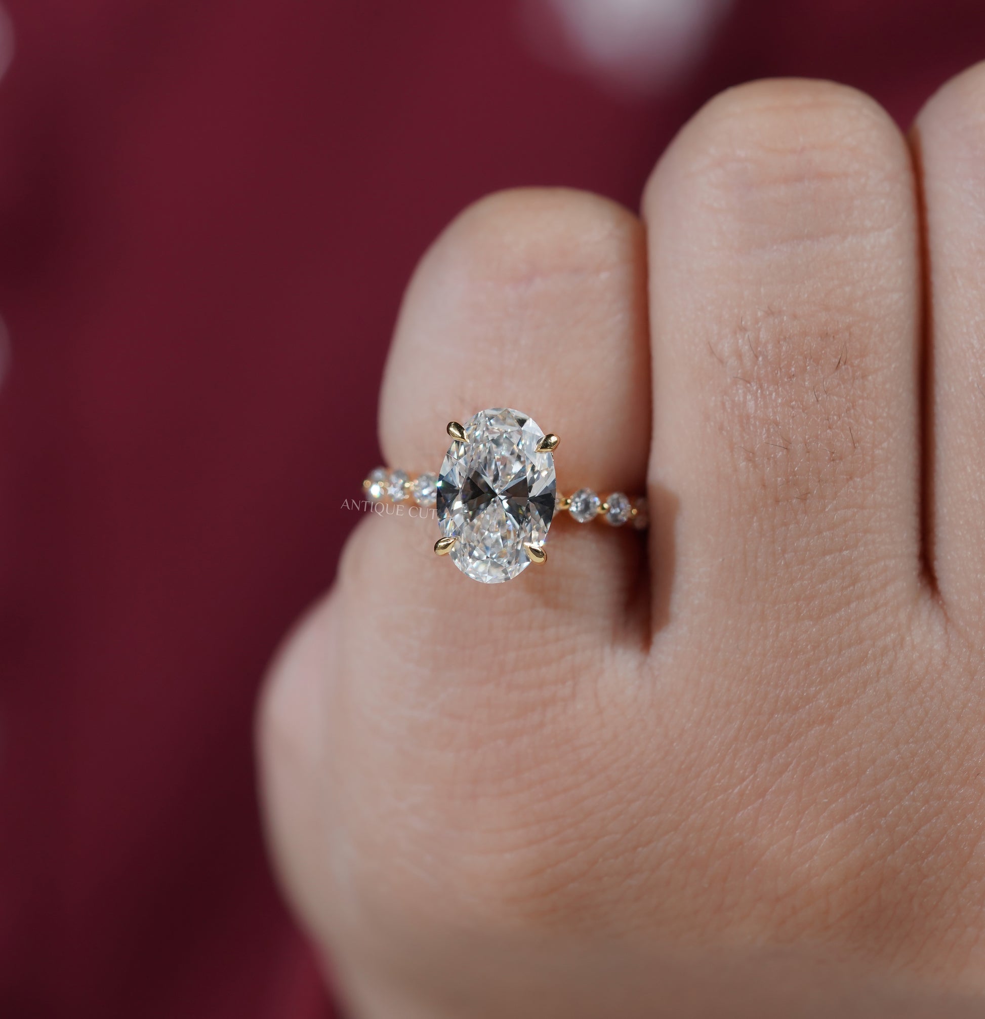Oval lab grown diamond ring with round side stones