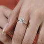 Yellow gold emerald diamond engagement ring with halo detail