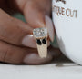 Yellow gold engagement ring with radiant diamond center and four prong setting