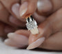 Yellow gold solitaire ring with rectangular radiant cut diamond center stone