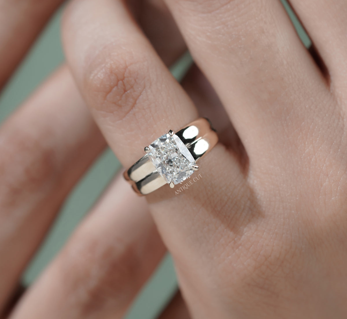 Radiant cut diamond ring with thick yellow gold band and solitaire setting