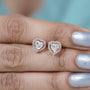 Rose gold halo diamond stud earrings with heart cut center