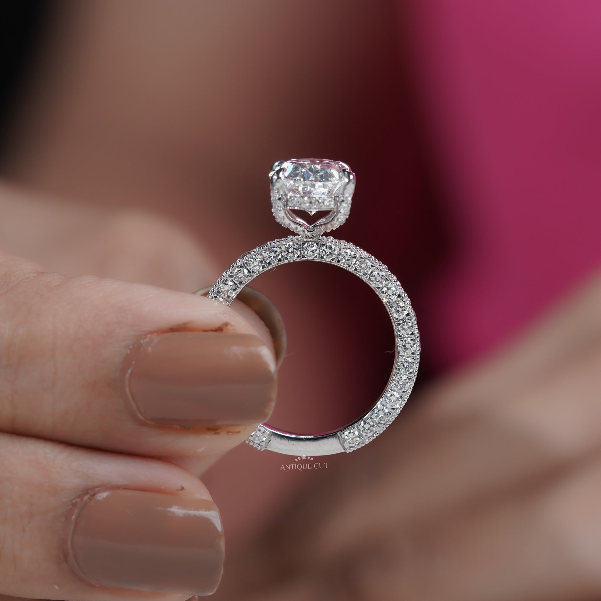 Elegant oval solitaire ring with hidden halo and diamond band