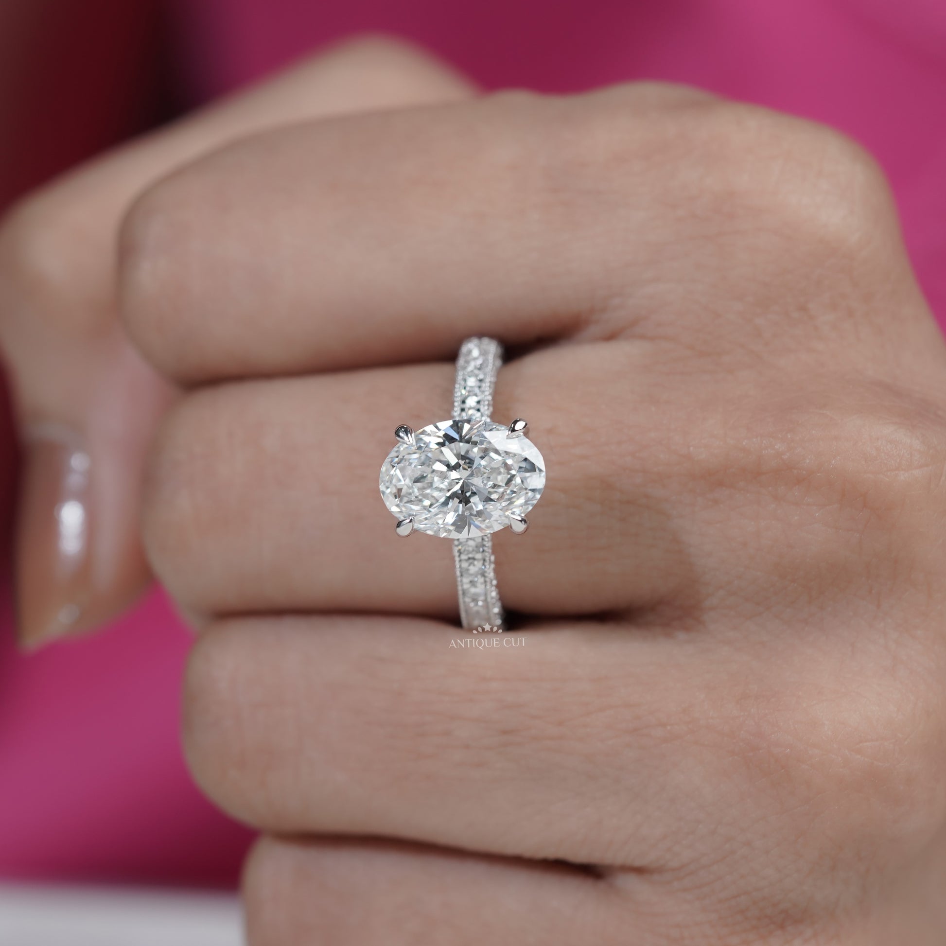 Classic oval cut diamond ring with pavé shank design