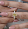 Hidden halo ring with an oval yellow diamond