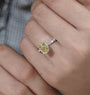 Pavé band engagement ring with a yellow center stone