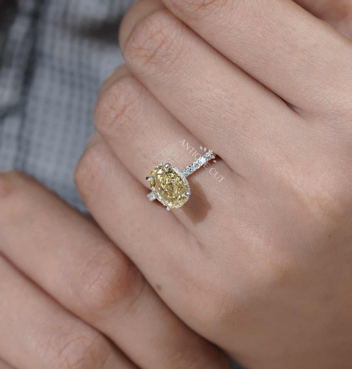 Pavé band engagement ring with a yellow center stone