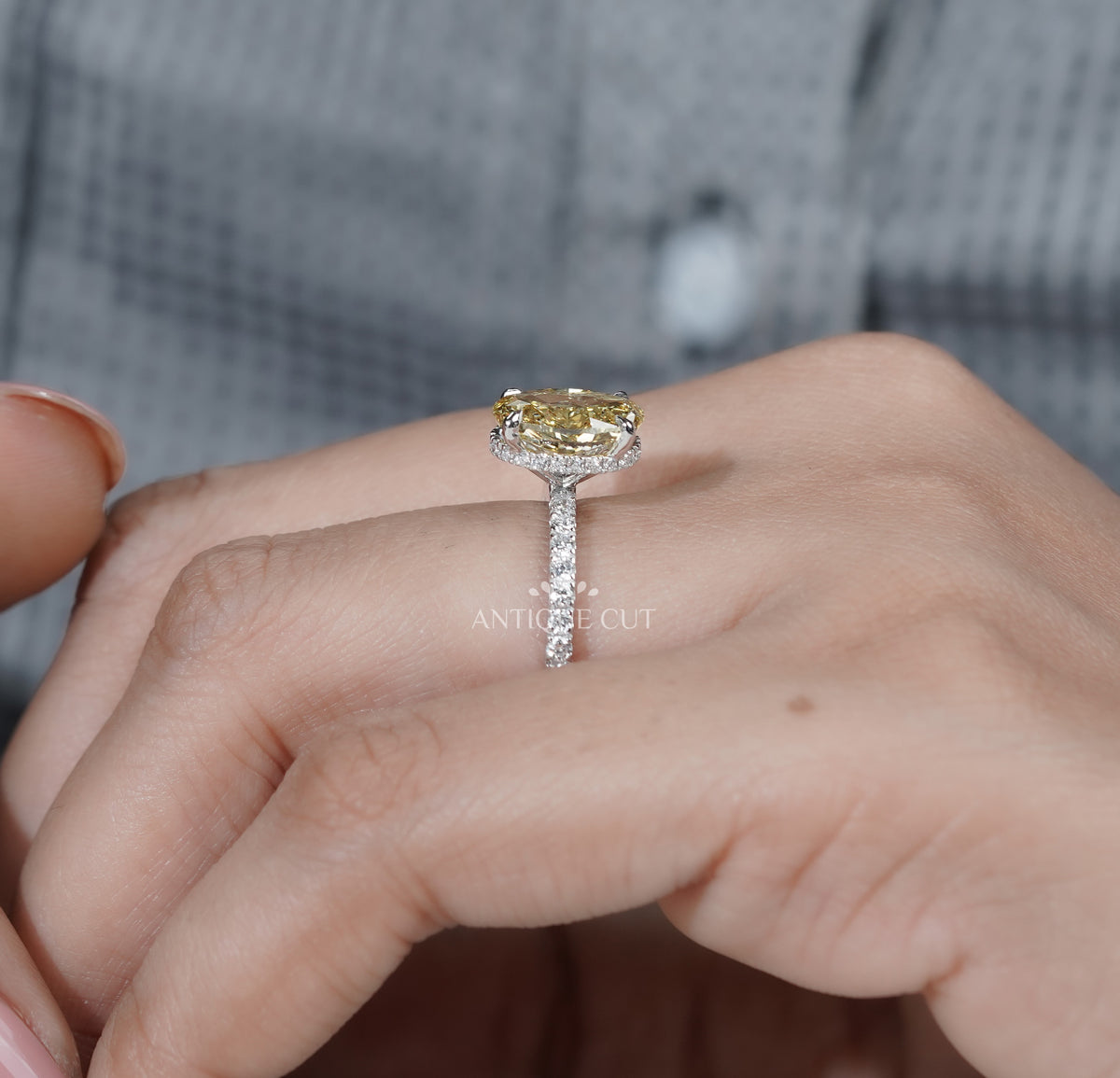 Oval yellow diamond engagement ring with side detailing