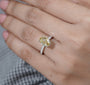 Colored diamond engagement ring with pavé band