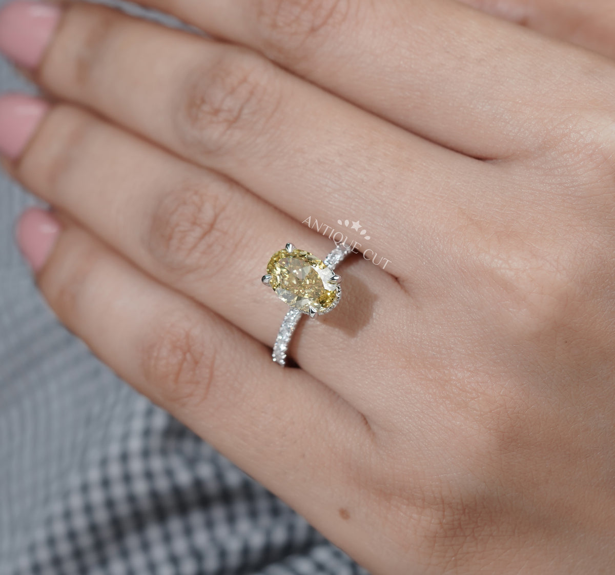 Colored diamond engagement ring with pavé band