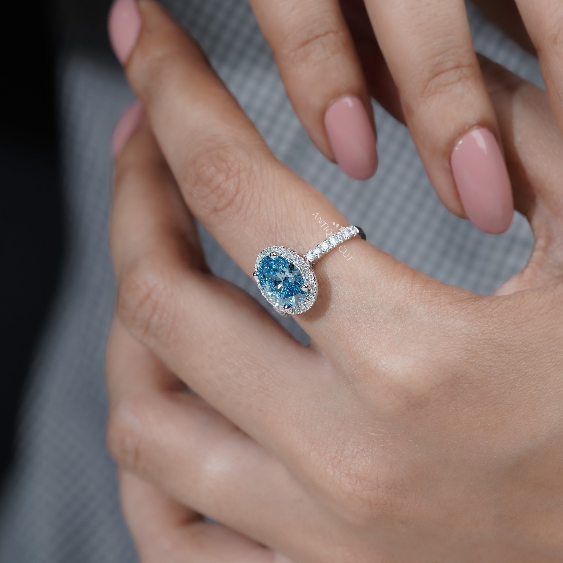 Fancy Blue Diamond Ring with Oval Halo and Pave Band