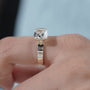 Close up of cushion cut diamond half bezel engagement ring
