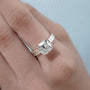 East west cushion cut engagement ring with half bezel and IGI certified diamond