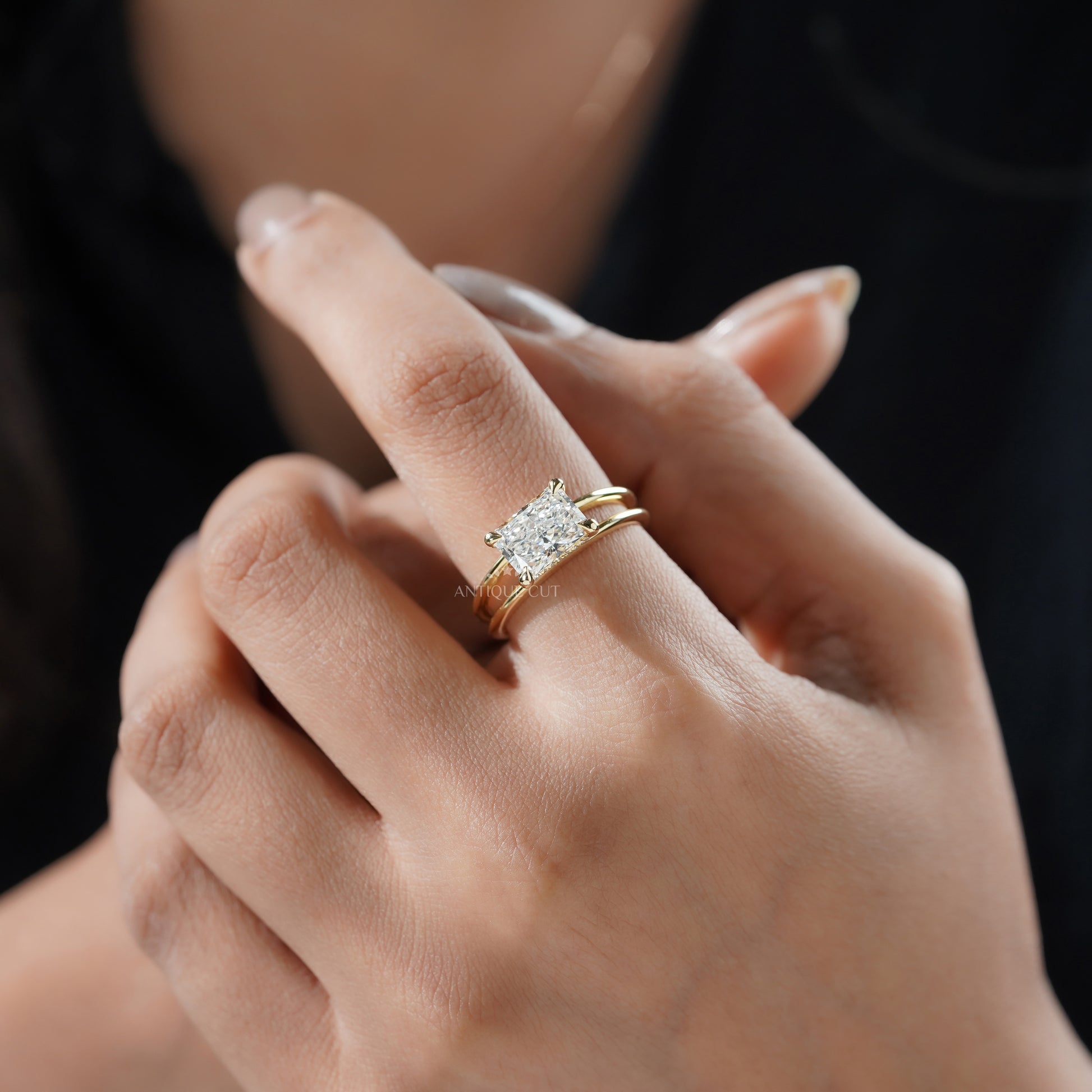 Sophisticated east west radiant cut diamond engagement ring