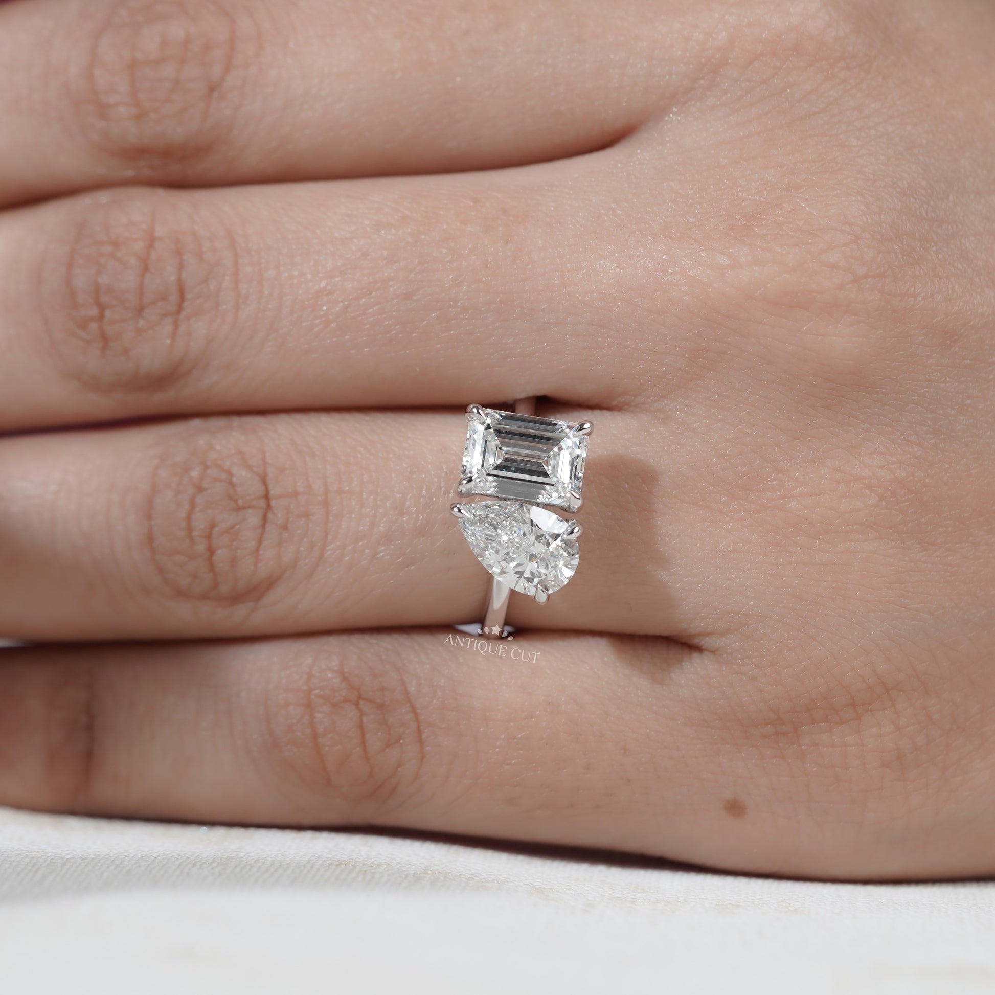 Emerald cut and pear cut diamond engagement ring design