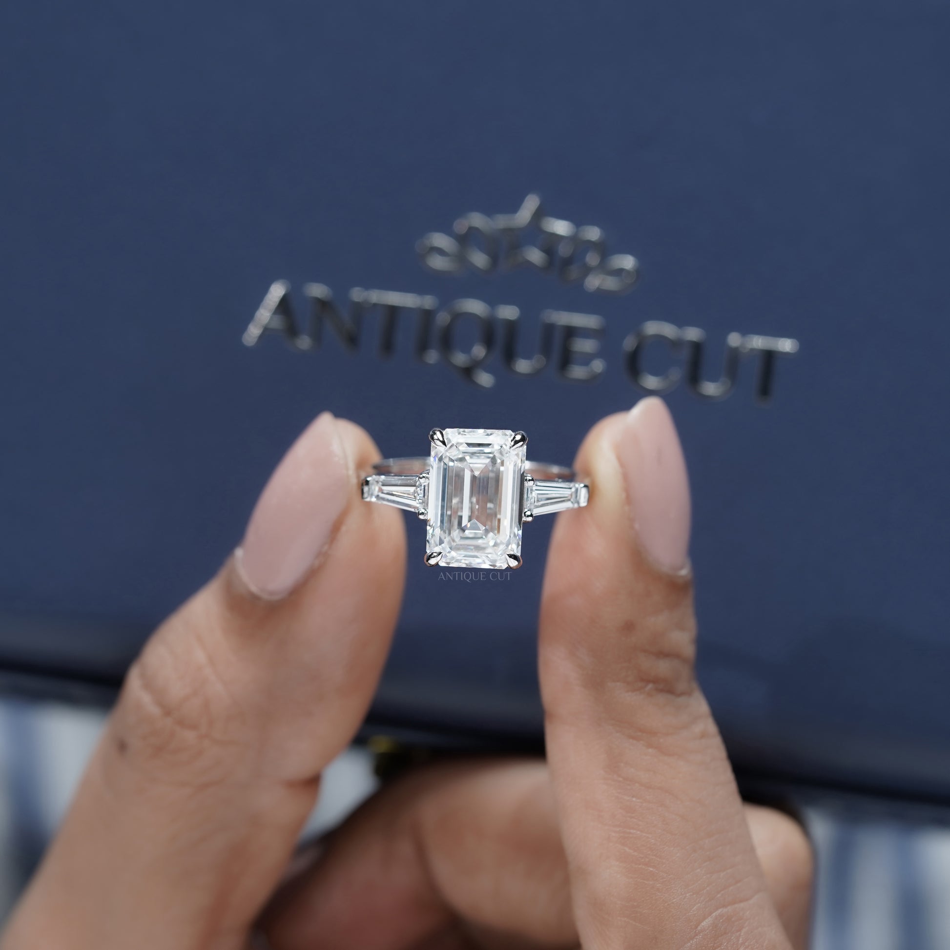 Emerald Cut 5.60tcw Lab Grown Diamond Three Stone Engagement Ring | Baguette Side Stones | Platinum/White Gold | IGI Certified