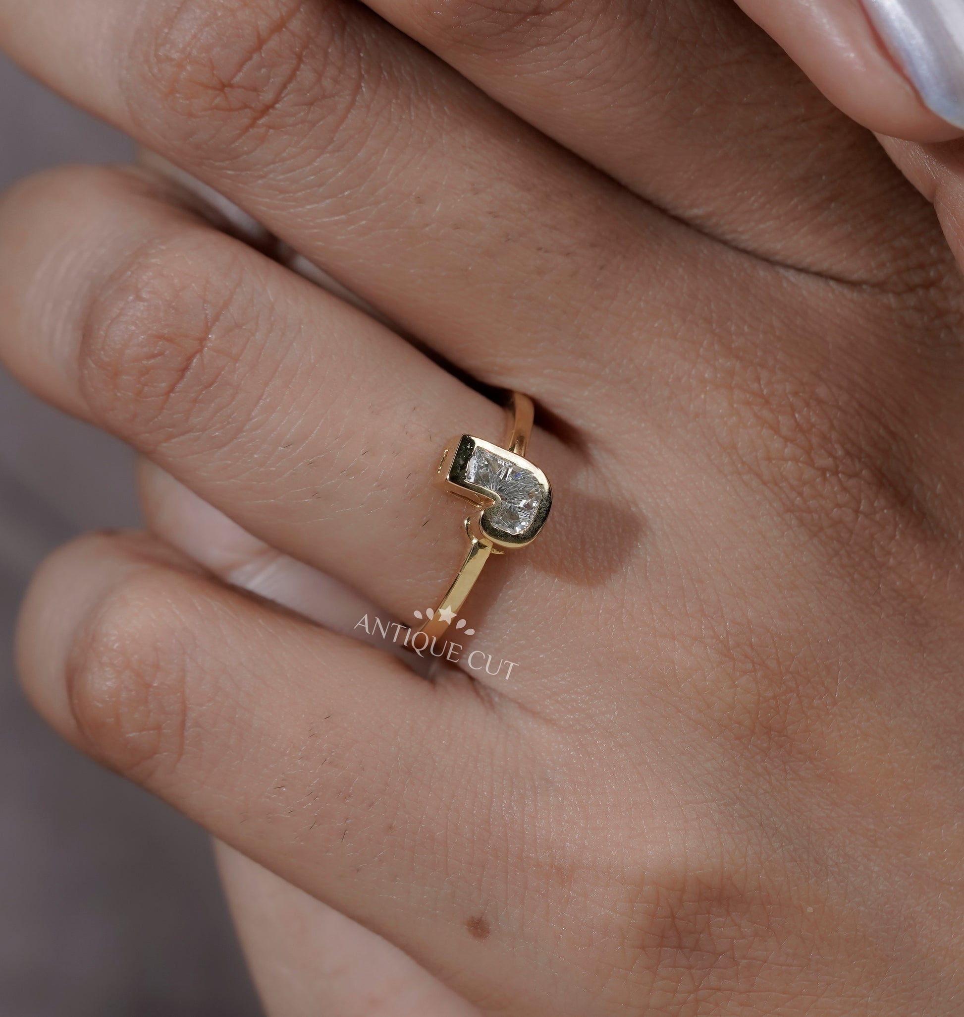 J letter lab grown diamond ring with bezel setting and yellow gold band