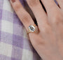 cushion cut diamond engagement ring with double-prong setting.